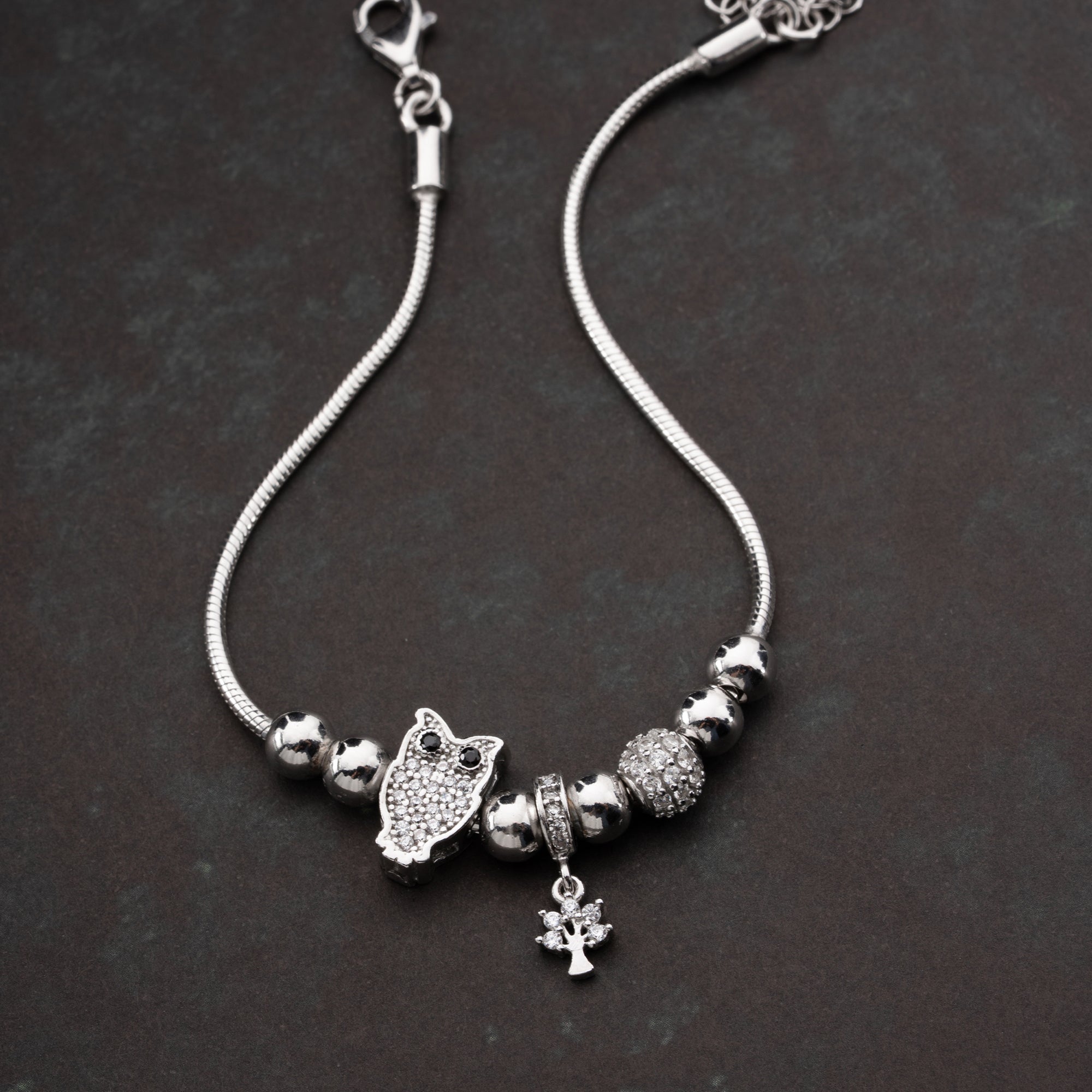 CHARMARMBAND MED UGGLA | 925 SILVER