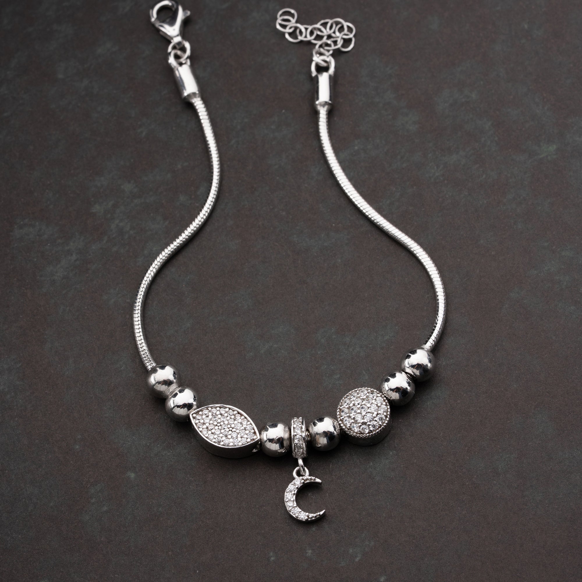 CHARMARMBAND MED HALVMÅNE | 925 SILVER